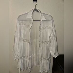 Light summer cover top. White loose fit with wide arms.